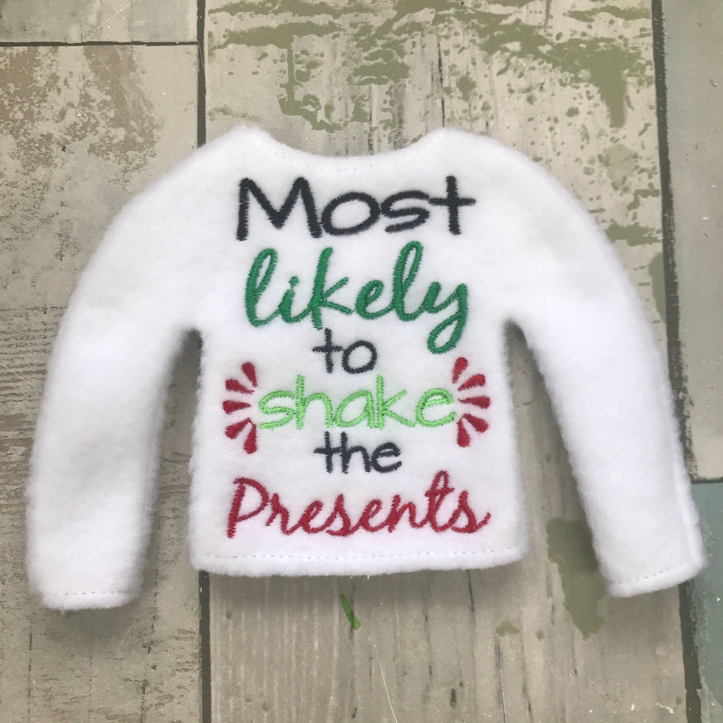Most likely shake all the presents Elf Sweater